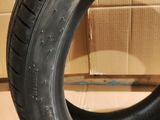 tires are stacked on top of a cardboard box on the floor