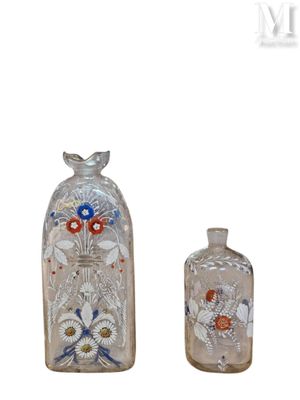 three glass bottles that are sitting next to each other