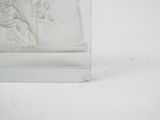 a glass block with a picture of a man and a woman on it