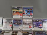 a lot of nintendo wii games on the table