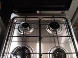 a silver stove top with two burners and a black top