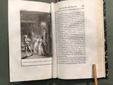 an open book with a picture of a man and a woman sitting at a table
