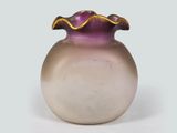 a vase with a purple and gold decoration on it
