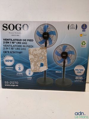 the box is open to show the contents of a small table fan