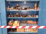 a blue cabinet with tools on it in a room