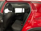 a red car with its door open and a black seat