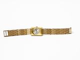 an image of a gold wrist watch with a white face on a white background