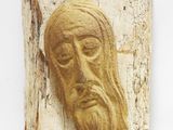 sculpture sur bois représentant le visage d'un homme