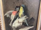 a painting of two birds hanging from a branch