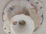 a white plate with a flower design on it