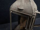 a small metal lantern that is sitting on a table