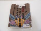 a brown shirt with a colorful design on it
