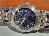 a close up of a watch on a table