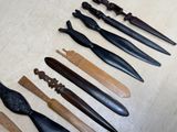 a lot of different types of knifes on the table