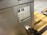 a machine that is sitting on a pallet in a warehouse