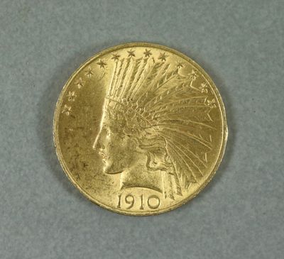 une image représentant une pièce d'or sur laquelle figure une coiffe