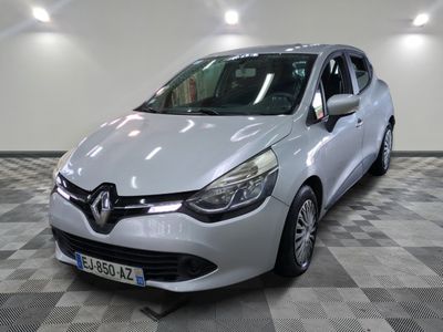 the white car is parked on a checkered floor in the garage