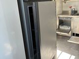 an image of a kitchen with a refrigerator in it