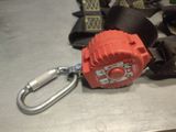 a close up of a red fire hydrant with a carabine