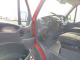 a red car with the door open and the driver ' s seat down