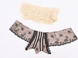 two pieces of underwear that are on a white surface