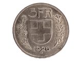 un gros plan d'une pièce de monnaie sur laquelle figure un blason
