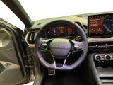 the interior of a car with a steering wheel, dashboard, and dash board