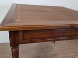an image of a wooden table with a drawer underneath it