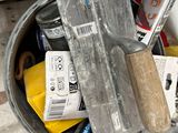 a bucket full of tools sitting on top of a table
