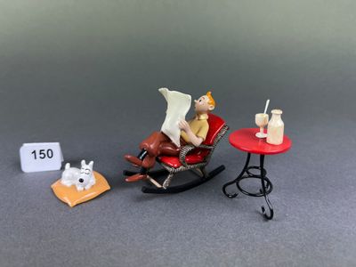 a miniature figurine of a man sitting in a rocking chair