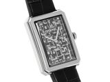 a black and white photo of a watch on a white background