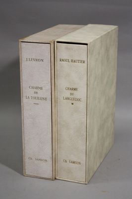 two books sitting on top of each other on a table