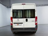 a white van that is parked inside of a building