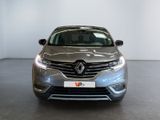 the front view of a silver car in a showroom