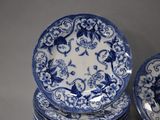 several blue and white plates are stacked on top of each other