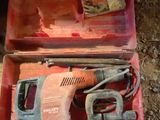 a red tool box with tools in it on the ground