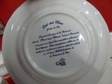 a white plate with a poem on it sitting on a table