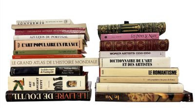 many books stacked on top of each other on a table