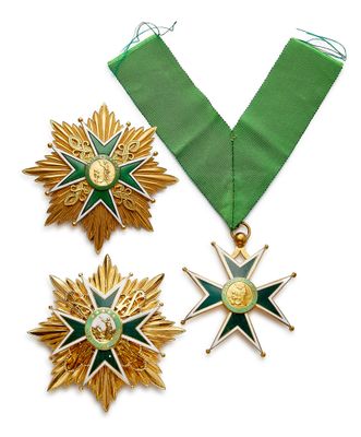 deux médailles et un ruban vert orné d'une étoile dorée