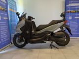a scooter that is parked in a showroom