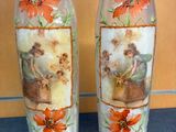 two vases that have pictures of people on them