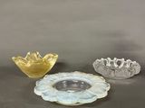three small glass bowls sitting on top of a table next to each other