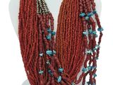 necklace made of red seed beads with turquoise beads
