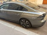 a silver car parked on the side of the street