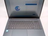 a laptop that is open on a white table