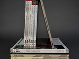 several books stacked on top of each other on a table