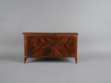 a walnut chest with a geometric design on the front