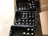 bottles of beer are stacked on top of each other on a table