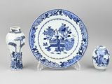 three blue and white vases and a blue and white plate