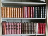 many books that are on the shelves in the room
